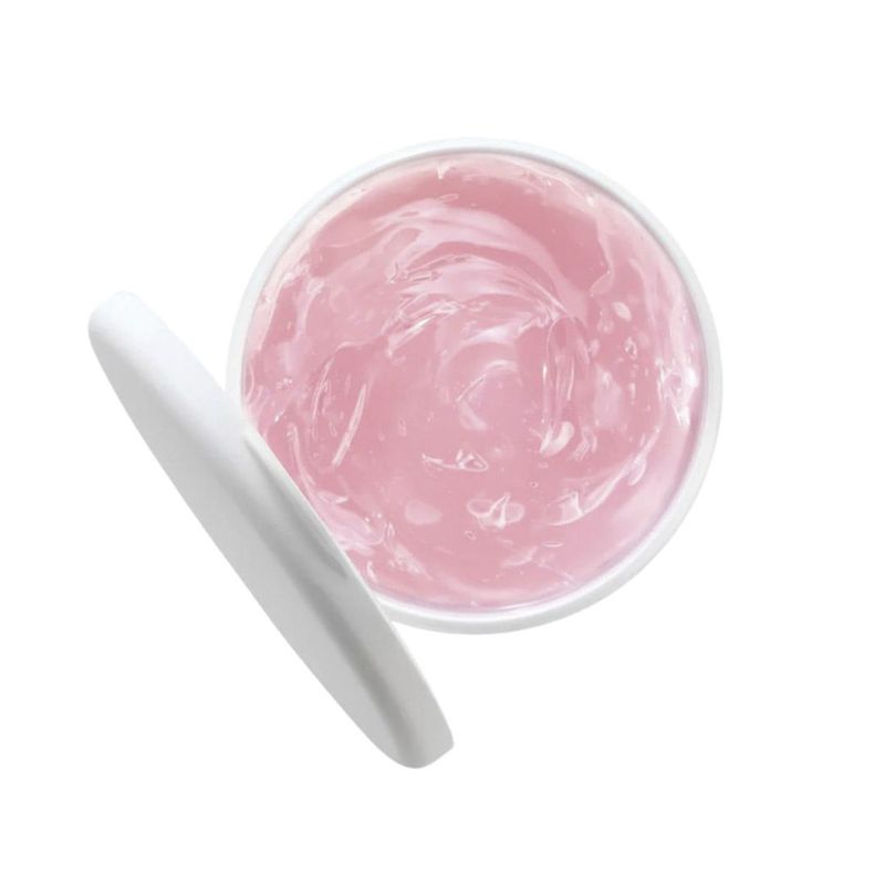 Primer-plano-de-la-textura-del-gel-para-piel-seca-de-Bio-Oil.-Crema-hidratante-de-color-rosa-en-el-interior-del-tarro